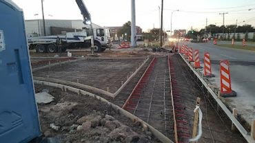 Road concrete pour with pump truck and traffic control