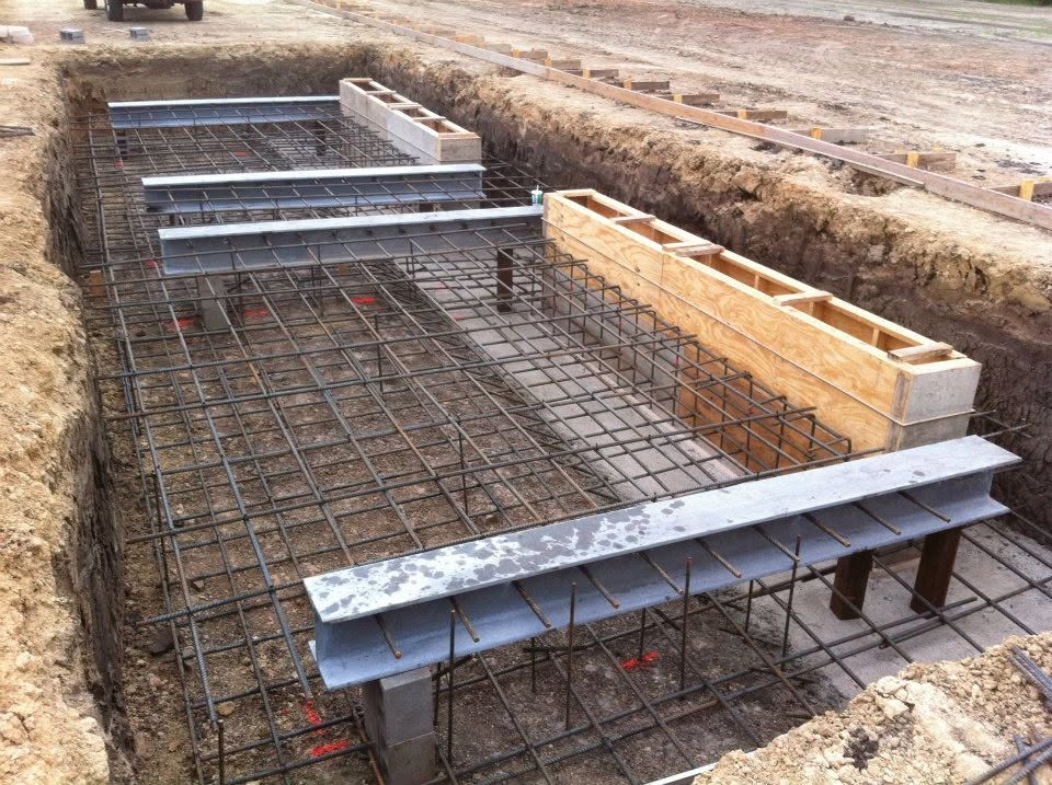 Rebar and steel I-beam foundation formwork in an excavated trench