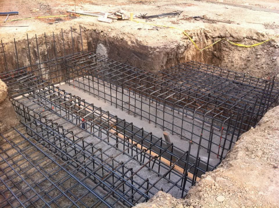 Workers pouring concrete